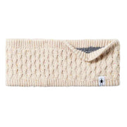 Beige knitted headband with a brand tag on a light gray background