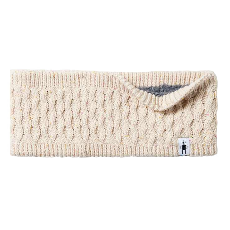 Beige knitted headband with a brand tag on a light gray background