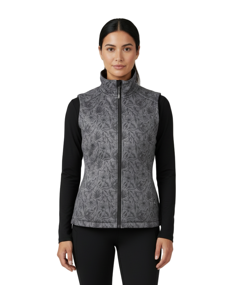 Model wearing a gray floral patterned vest on a white background