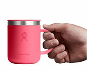 Pink travel mug with a Hydroflask logo on it on a white background.