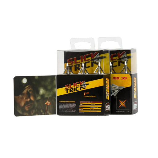 Two boxes of Slick Trick 100 SS broadheads arranged on a white studio background, with one box open to show the details inside and a small card featuring a hunter photo and arrow graphic placed to the left.