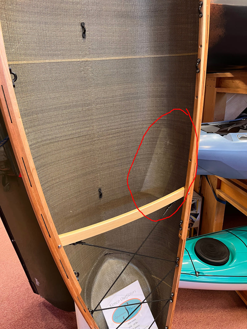 Carbon-kevlar canoe with cherry wood gunwales, close-up of hull interior to show a patch. 