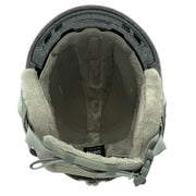 Close-up of a helmet interior with padding and straps on a white background