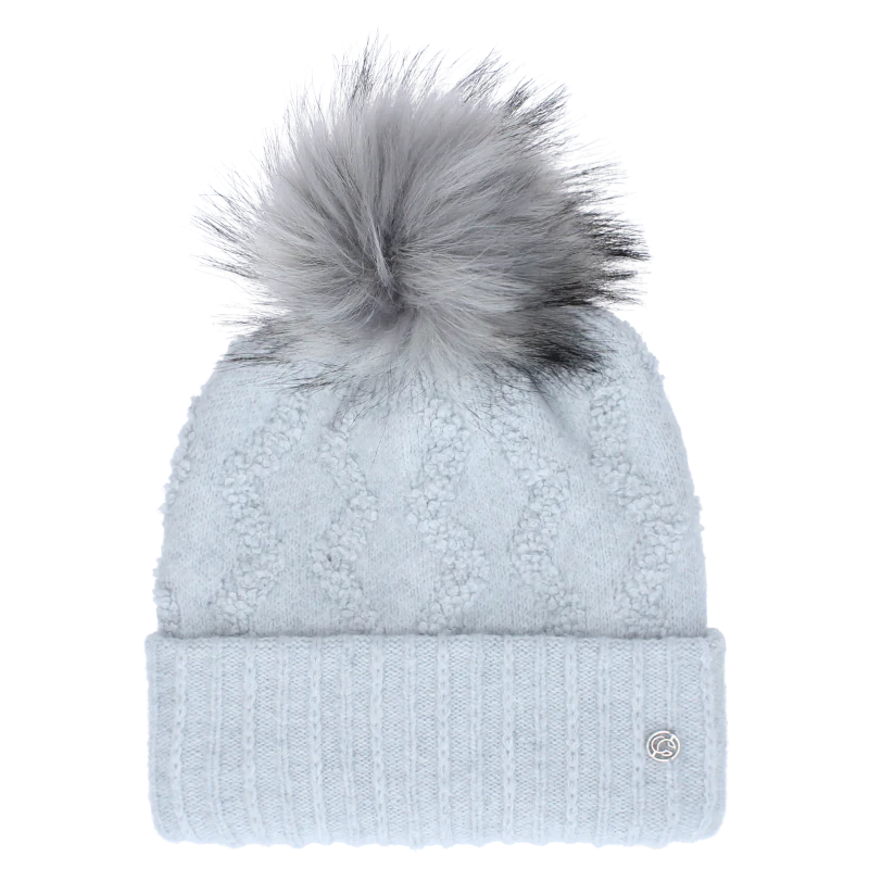 Baby blue pom pom beanie against a white background. 