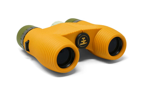 A yellow pair of binoculars with green lenses on a white background