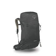 An Osprey Stratos 36 hiking backpack in dark gray, shown from a three-quarters angle on a white background with a soft shadow underneath.
