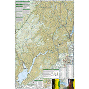 A detailed topographic map poster of New York State's Adirondack Park in the Lake George/Great Sacandaga areas, featuring tan terrain, water bodies, roads, and informational panels along the borders, including a National Geographic Backcountry Pack section.