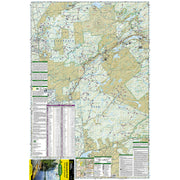 A detailed topographical map of the Old Forge/Oswegatchie region of the Adirondack Park, featuring roads, waterways, land boundaries, and various informational panels, with a National Geographic cover visible at the bottom.