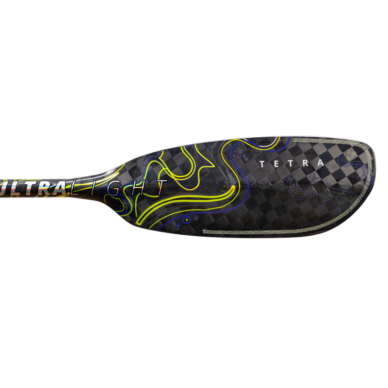 Black and grey paddle with yellow and dark blue accents and a Tetra logo on a white background.