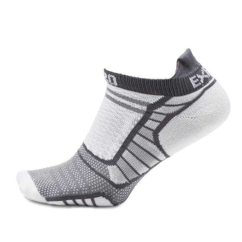 Side view of a white and grey ankle sock against a white background. 