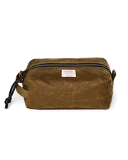 Light brown travel bag with Filson logo against a white background. 