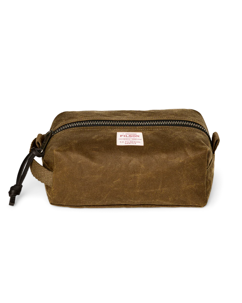 Light brown travel bag with Filson logo against a white background. 
