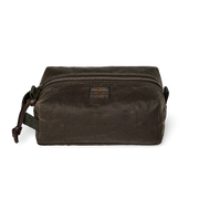 Dark green travel bag with Filson logo against a white background. 