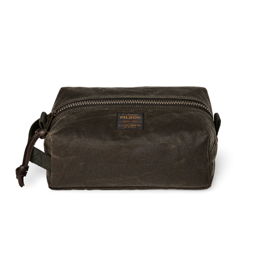 Dark green travel bag with Filson logo against a white background. 
