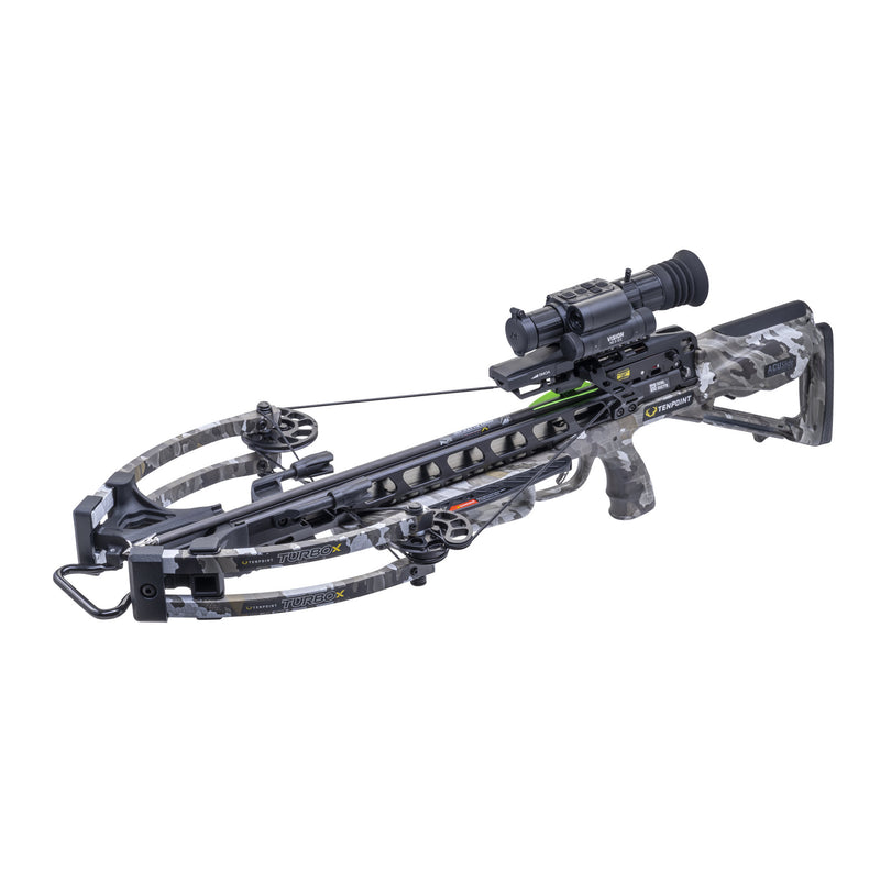A black compound crossbow with a mounted scope, featuring a camouflage-patterned stock, stabilizer, and riser, shown against a plain white background.