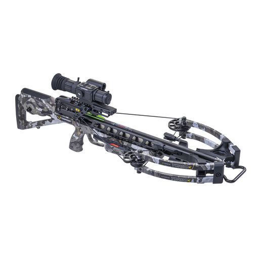 A black and gray camouflage compound crossbow with an attached scope, photographed on a solid white background.