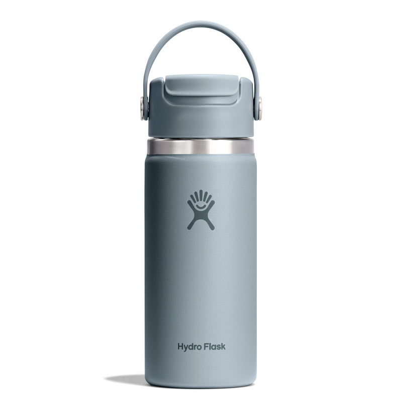 A Hydro Flask insulated water bottle in a muted slate blue-gray color, featuring a matching gray lid with a carrying loop and a silver stainless steel collar, shown on a clean white background.