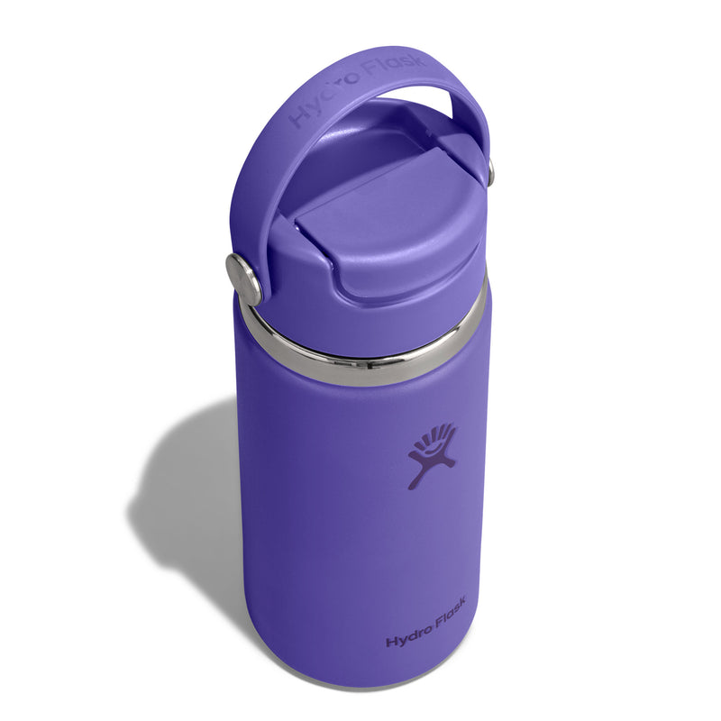 A purple Hydro Flask insulated water bottle with a matching purple flip-top lid and carry loop, shown on a white background with a soft shadow.