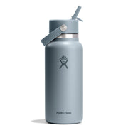 A matte slate blue Hydro Flask insulated water bottle with a matching lid, carrying loop, and straw, shown on a clean white background.
