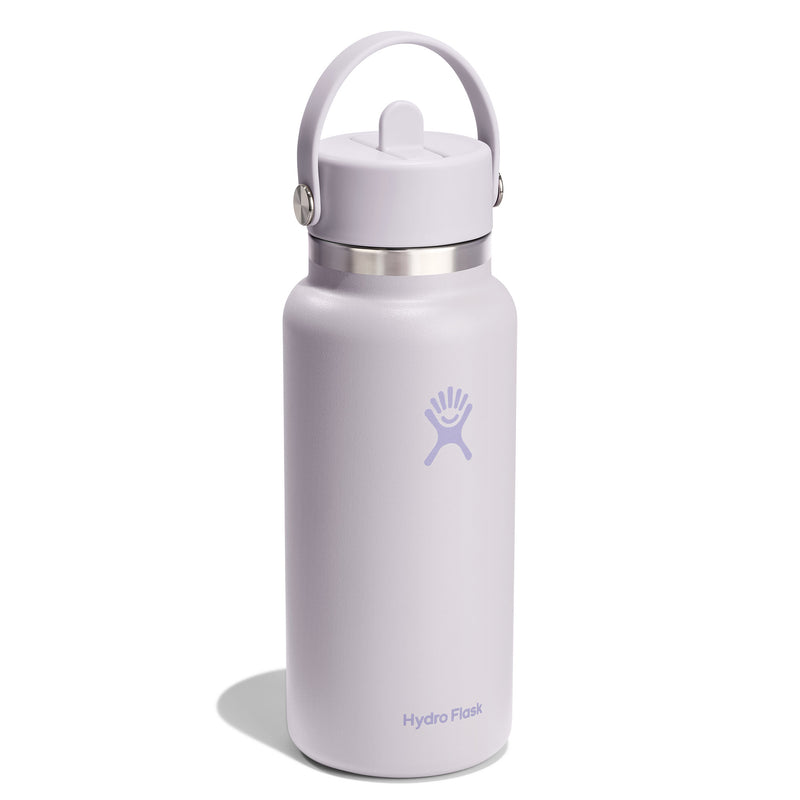 A Hydro Flask insulated water bottle in a pale lavender color, featuring a matching lavender lid with a carry loop and a silver stainless steel collar, set against a plain white background.