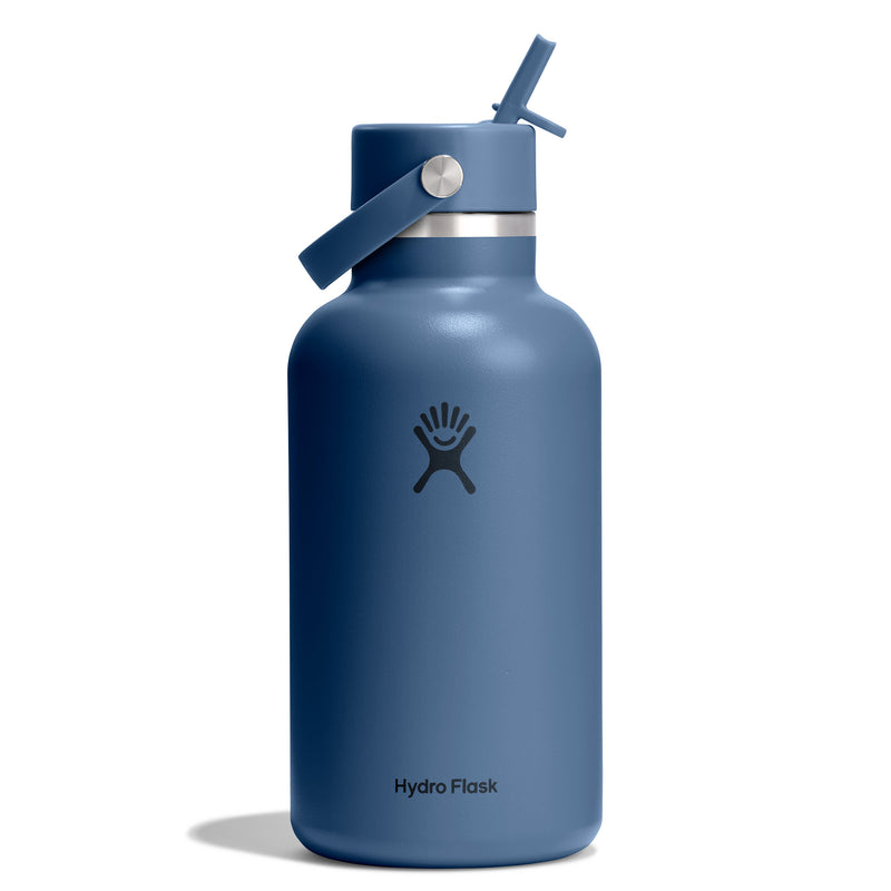 A matte slate blue Hydro Flask water bottle with a matching blue flip-straw lid, shown on a clean white background.