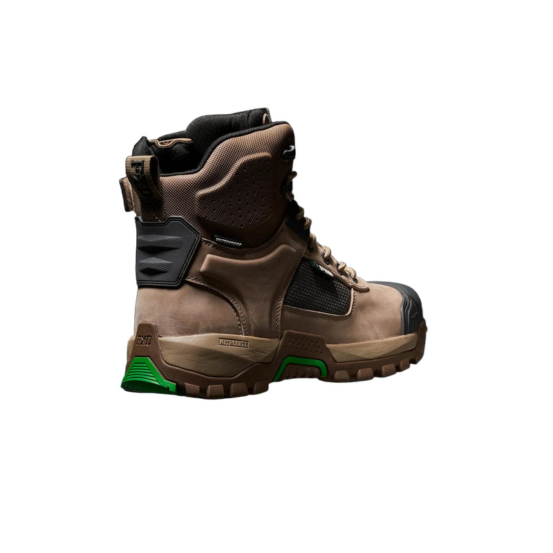 A single mid-cut tactical boot in brown and black with a bright green accent on the outsole, shown in a side profile against a dark studio background with a blue glow.