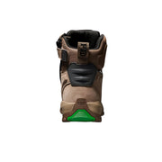 A single FXD snowboard boot shown from the back, featuring a tan and brown suede and synthetic upper with black protective panels and a bright green accent on the sole, set against a dark background with a blue glow.