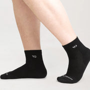 Black socks with a logo on a light gray background
