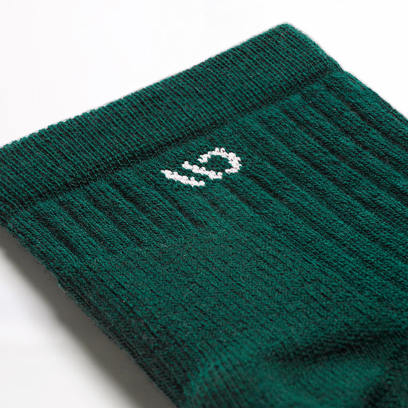 Green sock with a logo on a white background