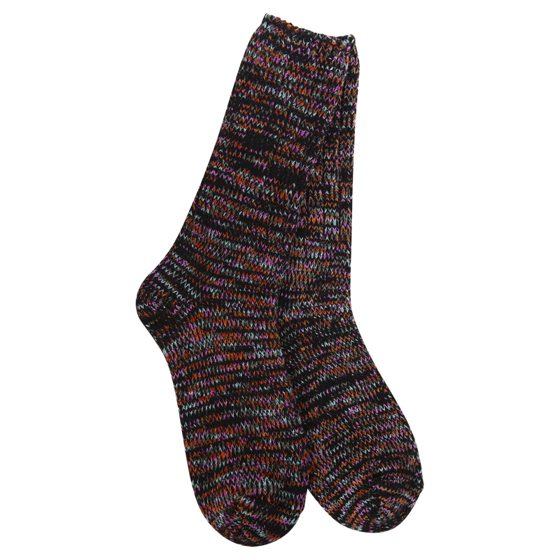 Pair of black and multicolor socks against a white ackground.