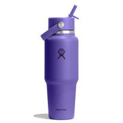 A purple Hydro Flask insulated water bottle with a matching purple lid and straw, featuring the Hydro Flask logo on the front, set against a plain white background.