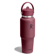 A Hydro Flask insulated water bottle in a dusty rose or mauve color, featuring a matching lid with a carrying loop, a silver metal band, and the Hydro Flask logo on the front, set against a plain white background.