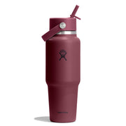 A Hydro Flask insulated water bottle in a matte burgundy color, featuring a matching burgundy lid with a carry loop and straw, and a silver metal band near the top.