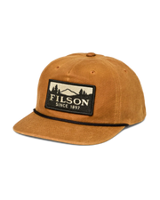 Front view of a light brown trucker cap with a Filson logo against a white background. 