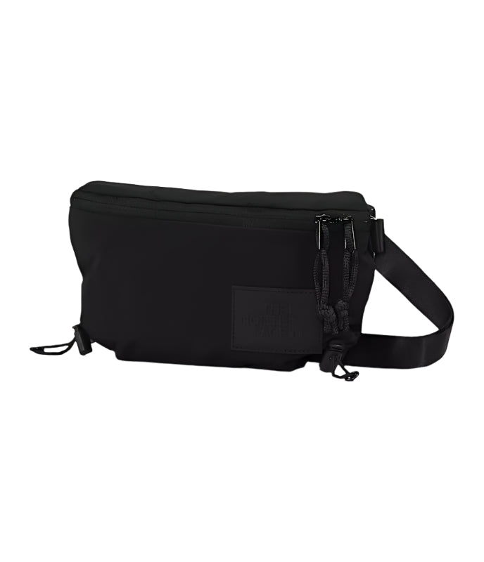 Black waist bag with a visible brand logo patch in monochrome black