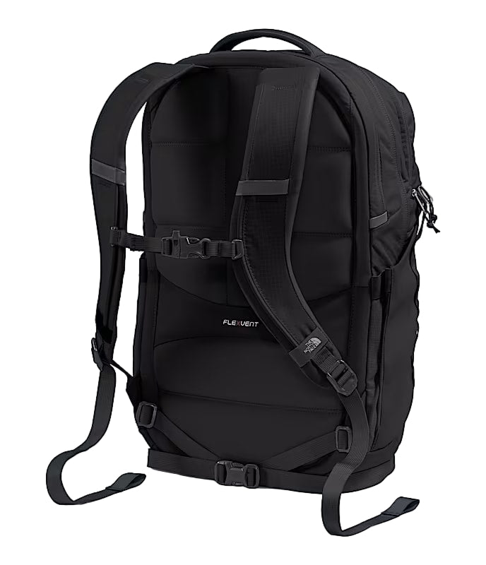 Back view of a black backpack against a white background. 