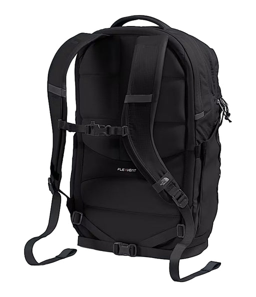Back view of a black backpack against a white background. 