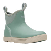 Green rain boot with beige sole on a white background