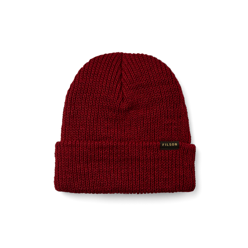 Red beanie with a tan Filson logo on it against a white background. 