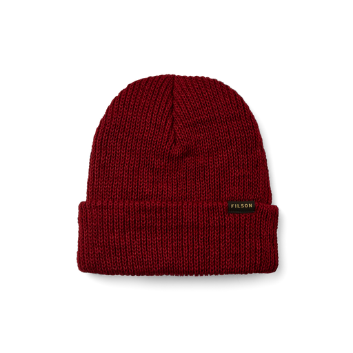 Red beanie with a tan Filson logo on it against a white background. 