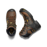 Top and side view of a brown and black work boot with yellow accents against a white background. 