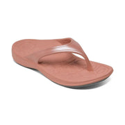 Image of a pink colored sandal with a visible grey bottom against a white background.