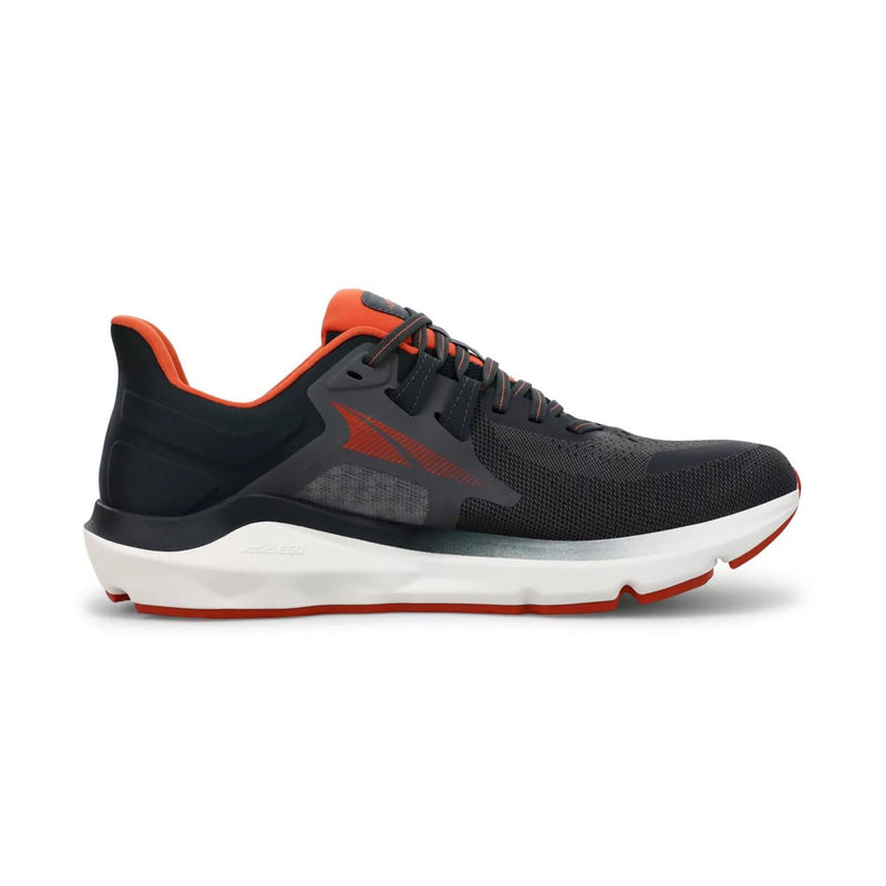 A black and red running shoe with a white bottom on a white background