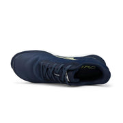 A blue running shoe from above on a white background