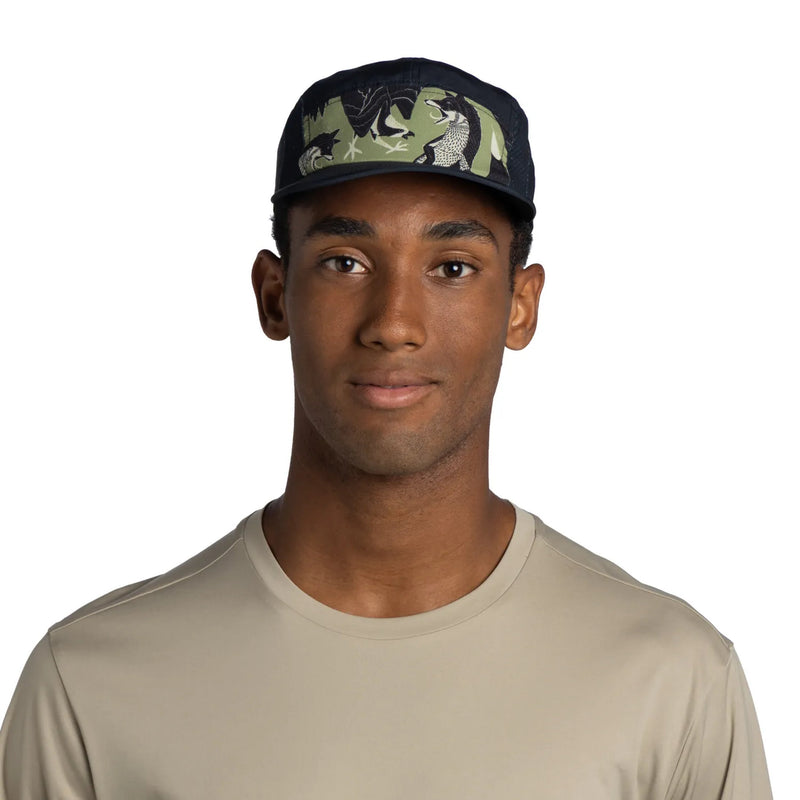 Man wearing a cap with a camouflage design on a white background
