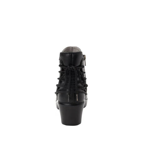Back view of a black ankle boot with a lace pattern on the back against a white background. 
