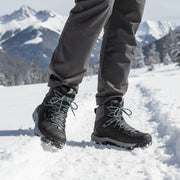 Pair of gray hiking boots with laces on a white background