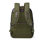 Back view of an olive colored backpack against a white background. 