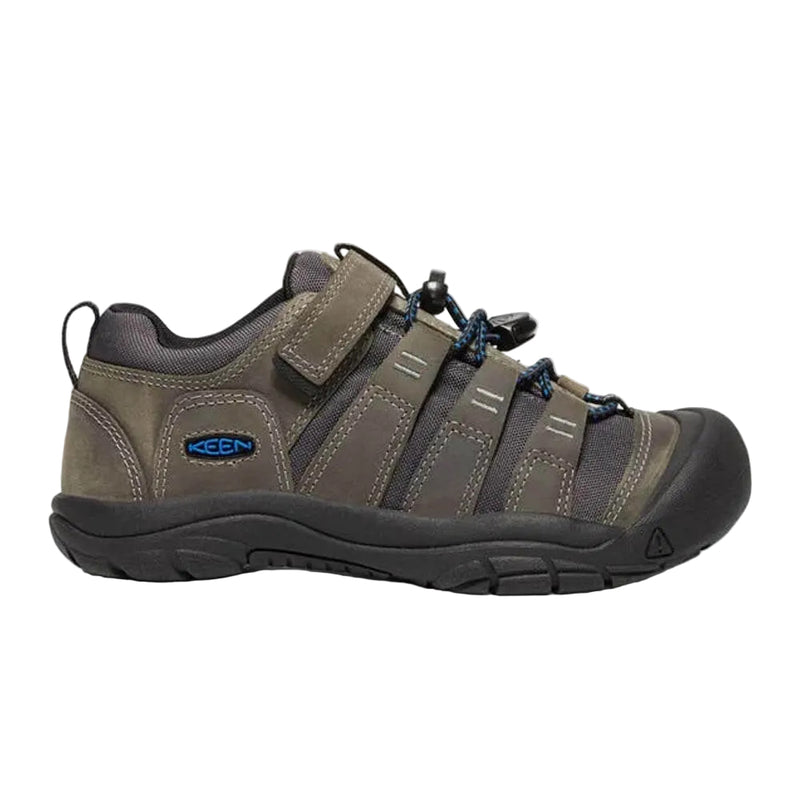 Brown hiking shoe with black sole on a white background