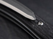 Close up image of a black knife handle.